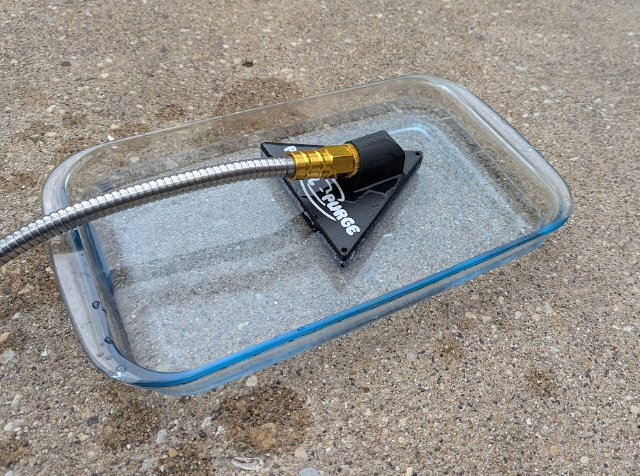 Before using PUD-L-PURGE: shallow water pooling on a flat surface